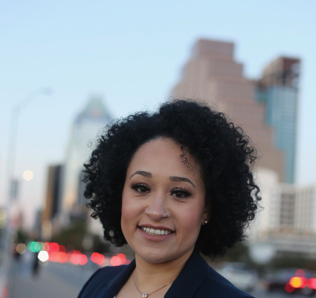 Xiomara Romero with Austin skyline at golden hour